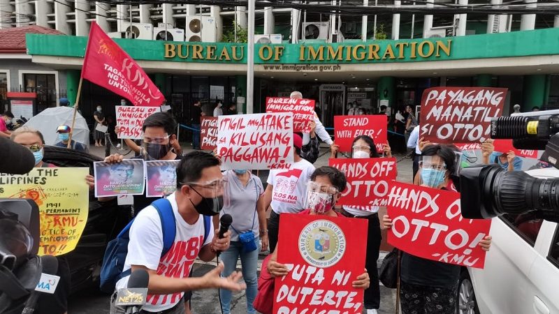 WATCH: KMU nagsagawa ng protesta sa BI; pagkansela sa permanent resident visa ng isang Dutch lay missionary kinondena